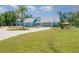 Beautiful home with a well-maintained lawn, circular driveway and two-car garage at 1305 Greenfield Cir, Venice, FL 34292