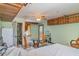 Multi-use living area with kitchenette, table, and access to the bathroom at 1305 Greenfield Cir, Venice, FL 34292