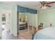 Spacious bedroom with a ceiling fan, large mirrored closet, and access to the back yard at 1305 Greenfield Cir, Venice, FL 34292