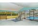 Outdoor patio with screened in lanai, seating, and view of the backyard and pool at 1305 Greenfield Cir, Venice, FL 34292