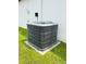 Carrier air conditioning unit shown next to house, kept on concrete foundation and surrounded by grass at 13486 English Sparrow Rd, Weeki Wachee, FL 34614