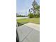 Backyard with a concrete patio and ample green space is perfect for outdoor entertaining at 13486 English Sparrow Rd, Weeki Wachee, FL 34614