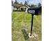 Curb view showcasing a mailbox and a glimpse of the front of the house at 13486 English Sparrow Rd, Weeki Wachee, FL 34614