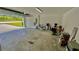 Spacious two-car garage with concrete floor and open overhead door at 13486 English Sparrow Rd, Weeki Wachee, FL 34614
