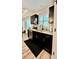 Stylish wet bar features stainless steel dishwasher and sink under a bright window at 13486 English Sparrow Rd, Weeki Wachee, FL 34614
