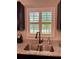 Kitchen sink with a view of the backyard at 13486 English Sparrow Rd, Weeki Wachee, FL 34614