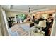 Inviting living room offers plenty of space, a large sectional, and a view into the dining area at 13486 English Sparrow Rd, Weeki Wachee, FL 34614