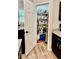 Walk-in pantry offers ample storage space with shelving and easy access from the kitchen at 13486 English Sparrow Rd, Weeki Wachee, FL 34614