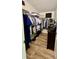 Walk-in closet with ample storage space and organization system at 13486 English Sparrow Rd, Weeki Wachee, FL 34614