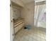 Bright bathroom featuring a tub, and vanity at 1695 Stable Trl, Palm Harbor, FL 34685