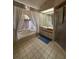 Bright bathroom featuring a tub, shower and vanity at 1695 Stable Trl, Palm Harbor, FL 34685