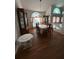 Formal dining room with elegant chandelier and large windows at 1695 Stable Trl, Palm Harbor, FL 34685