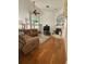 Open living room with high ceilings, hardwood floors, and cozy fireplace at 1695 Stable Trl, Palm Harbor, FL 34685