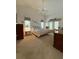 Spacious main bedroom with French doors and ensuite bath at 1695 Stable Trl, Palm Harbor, FL 34685