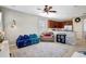 Cozy bonus room with comfortable seating and a view of the kitchen at 17419 New Cross Cir, Lithia, FL 33547