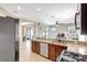 Open-concept kitchen with stainless steel appliances and granite countertops at 17419 New Cross Cir, Lithia, FL 33547