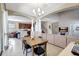 Open-concept living area featuring tile floors, archways, and views of the kitchen and staircase at 17419 New Cross Cir, Lithia, FL 33547