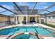 Beautiful screened-in pool with spa and outdoor seating area for relaxation and entertaining at 17419 New Cross Cir, Lithia, FL 33547