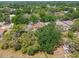 Lush green neighborhood with mature trees, single Gathering homes, and a view of a wide open field at 2719 Brookville Dr, Valrico, FL 33596
