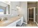 Bathroom featuring dual sinks, granite countertops, modern fixtures, and entry to closet at 2719 Brookville Dr, Valrico, FL 33596