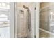 Modern bathroom with a glass-enclosed shower and multiple shower heads at 2719 Brookville Dr, Valrico, FL 33596