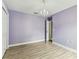 Bedroom with gray wood-look floors and a chandelier at 2719 Brookville Dr, Valrico, FL 33596