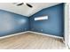 Bright bedroom featuring wood-look tile flooring and a sliding glass door at 2719 Brookville Dr, Valrico, FL 33596