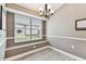 Cozy dining area with large window offering natural light and neutral color palette at 2719 Brookville Dr, Valrico, FL 33596