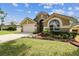 Charming single-Gathering home with well-maintained landscaping and a two-car garage at 2719 Brookville Dr, Valrico, FL 33596
