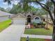 Beautiful single-Gathering home with well-kept lawn and a two-car garage, offering curb appeal at 2719 Brookville Dr, Valrico, FL 33596