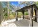 Outdoor gazebo with curtains, offering a cozy and stylish retreat on the deck at 2719 Brookville Dr, Valrico, FL 33596