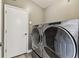 Convenient laundry room with modern washer and dryer units at 2719 Brookville Dr, Valrico, FL 33596