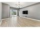 Spacious living room featuring tile floors, sliding glass doors to the lanai, and neutral colors at 2719 Brookville Dr, Valrico, FL 33596