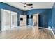 Open bedroom features a ceiling fan, and access to bathroom, closet and outdoor pool at 2719 Brookville Dr, Valrico, FL 33596