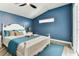 Inviting main bedroom with en-suite bathroom, tray ceiling and stylish furnishings at 2719 Brookville Dr, Valrico, FL 33596