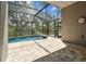 Spacious screened-in pool area with a patio, offering ample space for outdoor activities and relaxation at 2719 Brookville Dr, Valrico, FL 33596