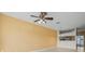 Open living room with ceiling fan and view into the kitchen area at 309 Countryside Key Blvd, Oldsmar, FL 34677