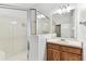 Bathroom featuring a glass shower and vanity with a mirror at 31434 Shaker Cir, Wesley Chapel, FL 33543