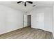 Second bedroom view showing the wood flooring and neutral walls at 31434 Shaker Cir, Wesley Chapel, FL 33543