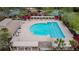Aerial view of the community pool with lounge seating and shade structures at 31434 Shaker Cir, Wesley Chapel, FL 33543