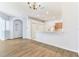 Bright living room with hardwood floors, neutral paint, and open access to the kitchen at 31434 Shaker Cir, Wesley Chapel, FL 33543