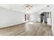 Inviting living room boasting wood-look floors, neutral paint, and abundant natural light at 31434 Shaker Cir, Wesley Chapel, FL 33543