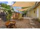 Backyard features a cozy fire pit, wooden table, and shaded patio area at 3600 46Th N St, St Petersburg, FL 33713