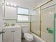 Bathroom featuring tub, tile surround, and updated vanity at 3600 46Th N St, St Petersburg, FL 33713