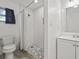 Bathroom with subway tile shower, mosaic tile floor, and updated vanity at 3600 46Th N St, St Petersburg, FL 33713