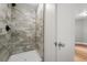 The renovated bathroom boasts a tiled walk-in shower and modern fixtures at 3600 46Th N St, St Petersburg, FL 33713
