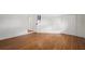 Spacious bedroom with wood floors, white trim and neutral paint throughout at 3600 46Th N St, St Petersburg, FL 33713