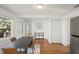Dining room features a modern table set, wood floors, and ample natural light at 3600 46Th N St, St Petersburg, FL 33713