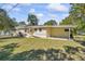 Charming single-story home with a well-maintained lawn and covered parking space at 3600 46Th N St, St Petersburg, FL 33713
