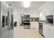 Spacious kitchen featuring stainless steel appliances, white cabinets, and open layout at 3600 46Th N St, St Petersburg, FL 33713